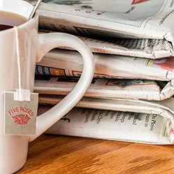 image of mug and newspapers